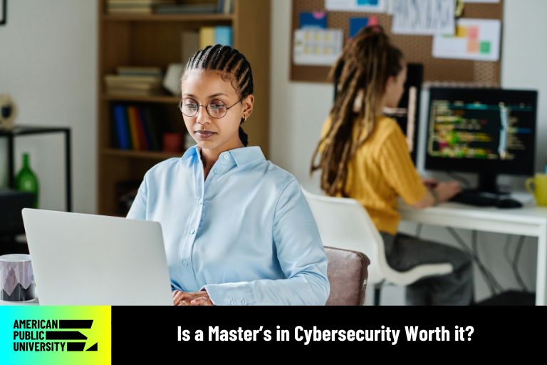 masters in cybersecurity student with laptop