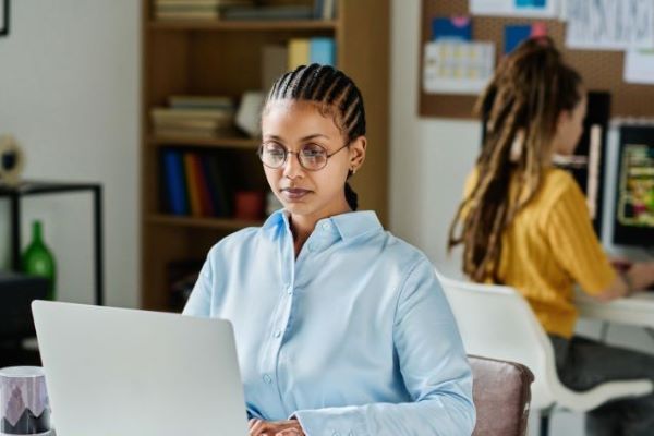 masters in cybersecurity student with laptop