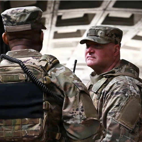 Military Men Talking at Metro Station