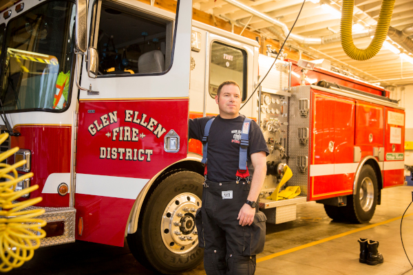 Male in front of Fire Truck