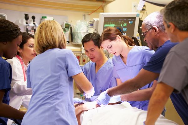 nurses working on patient