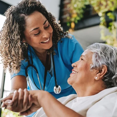 Female nurse smiling at patient