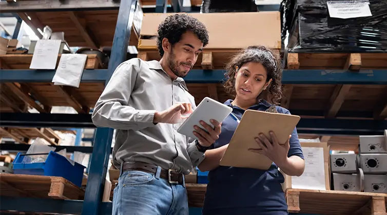 A man and a woman looking at information together