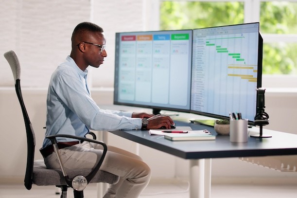 IT project manager sitting at computer