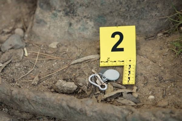 crime scene with evidence marker 2 near keys in dirt