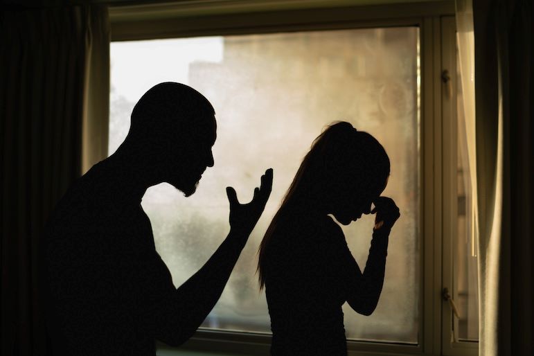 silhouettes of humans arguing
