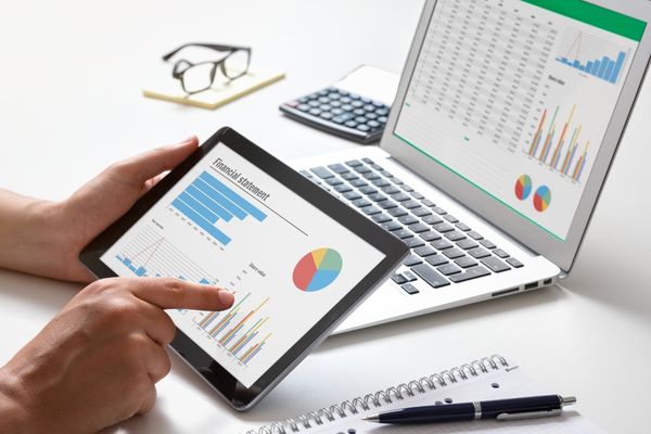 business analyst looking at data on tablet