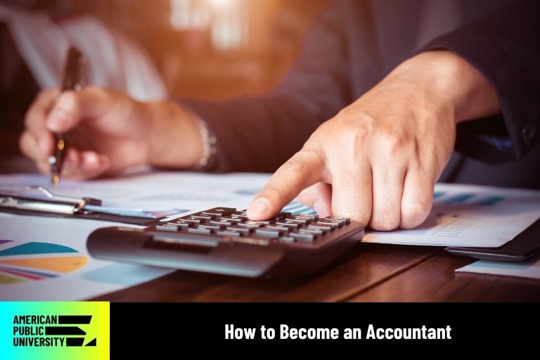 accountant working on calculator