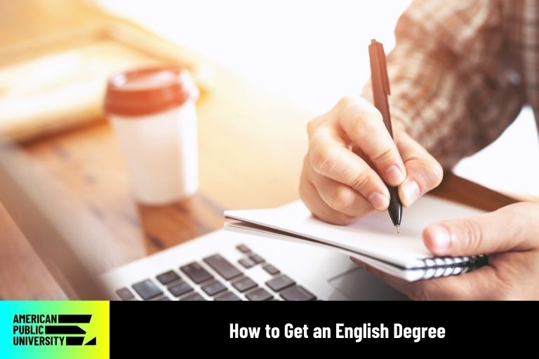 English degree student writing in notebook