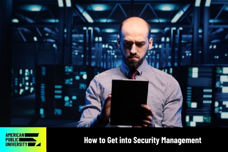security management professional looking at tablet