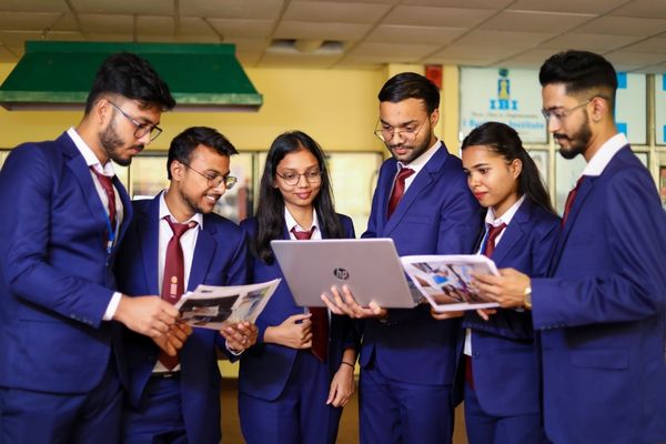master's in political science students looking at laptop