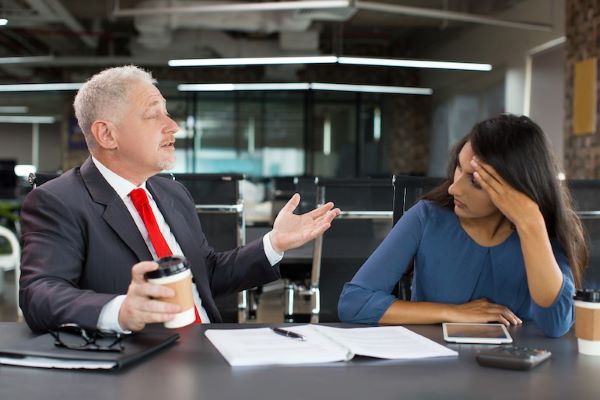 leader talking to a subordinate, not reading nonverbal queues