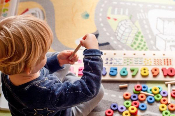 preschool student playing with blocks