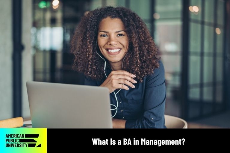 BA in Management student on laptop