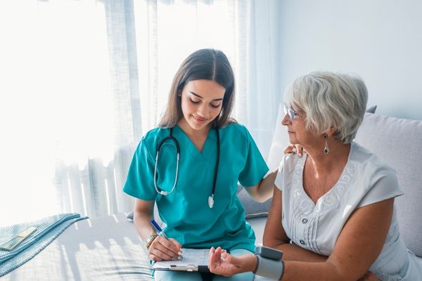 BSN nurse with patient
